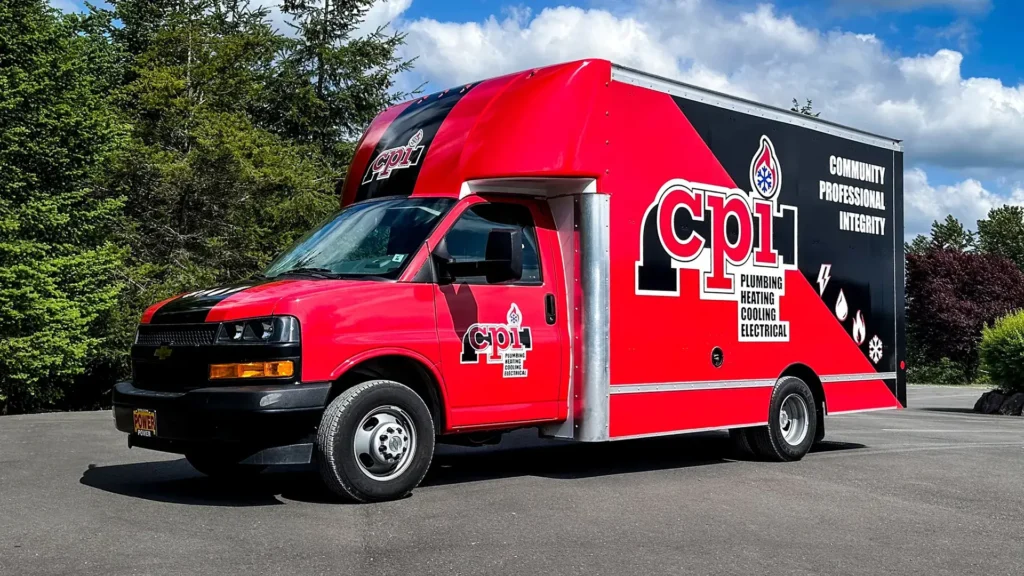 Red and black service truck branded with CPI logo offering plumbing, heating, cooling, and electrical services. Community Professional Integrity.